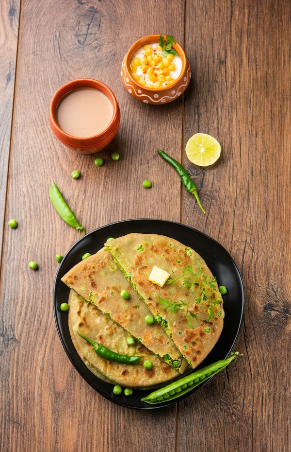 Wie bereitet man indische Aloo Paratha mit würziger Kartoffelfüllung zu?